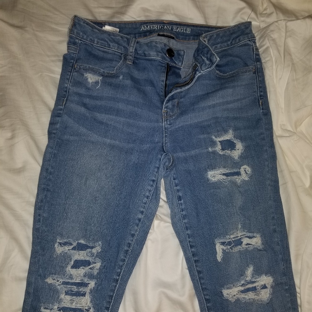 ripped mid wash high rise jegging